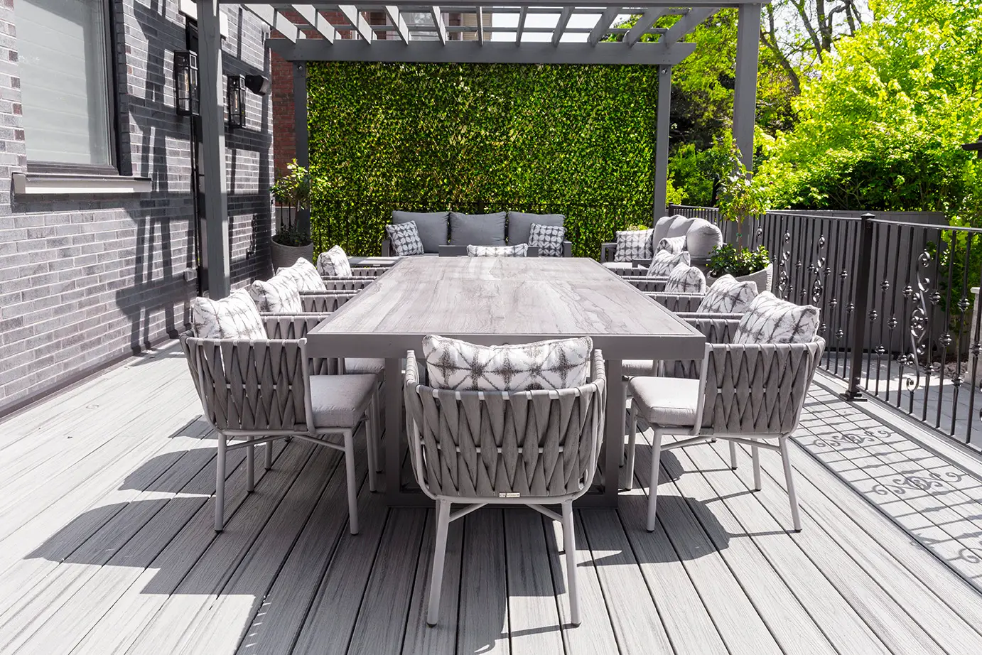 Commercial-grade outdoor furniture arranged in a resort-style setting with coordinated colors and textures.